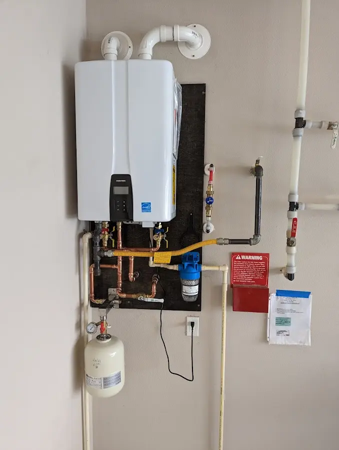 Professional plumber installing copper piping in a Carolina Forest home